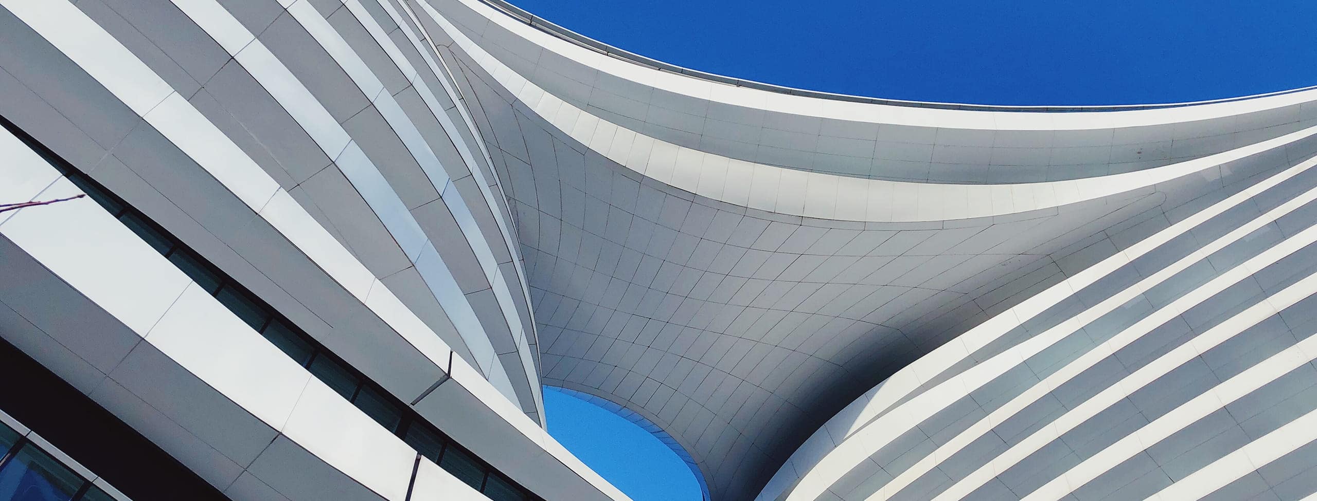 white building with blue backdrop