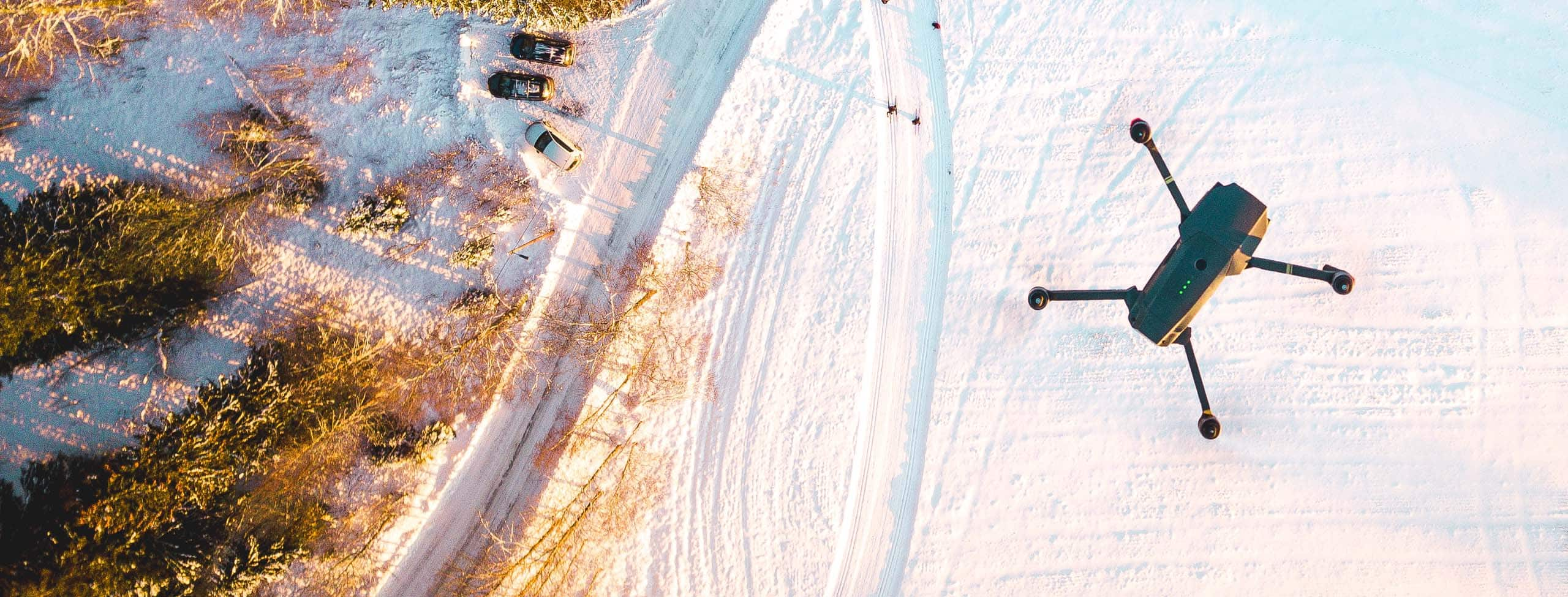 drone flying over snow