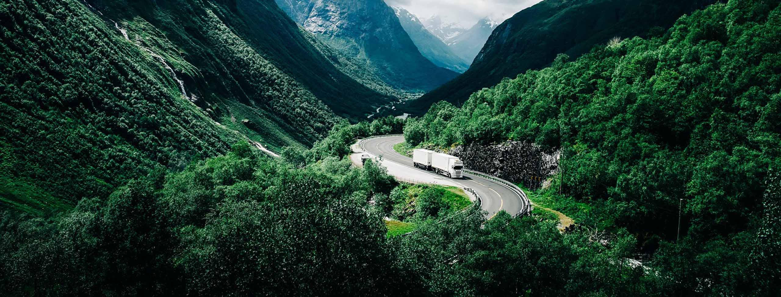 Truck driving through valley