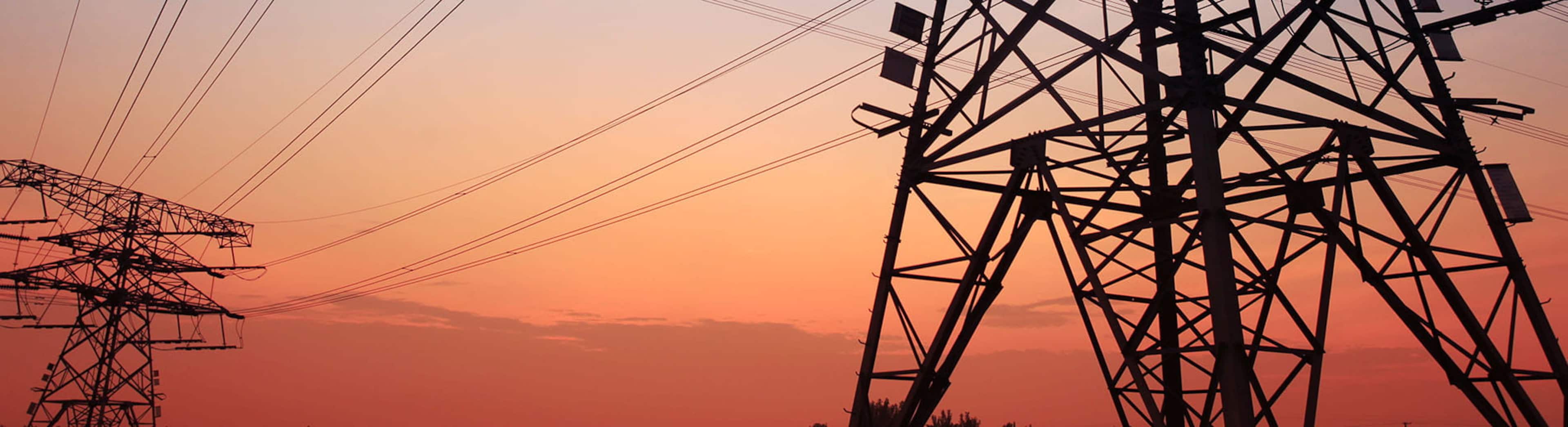 High_Voltage_Towers_At_Sunset_S_2305