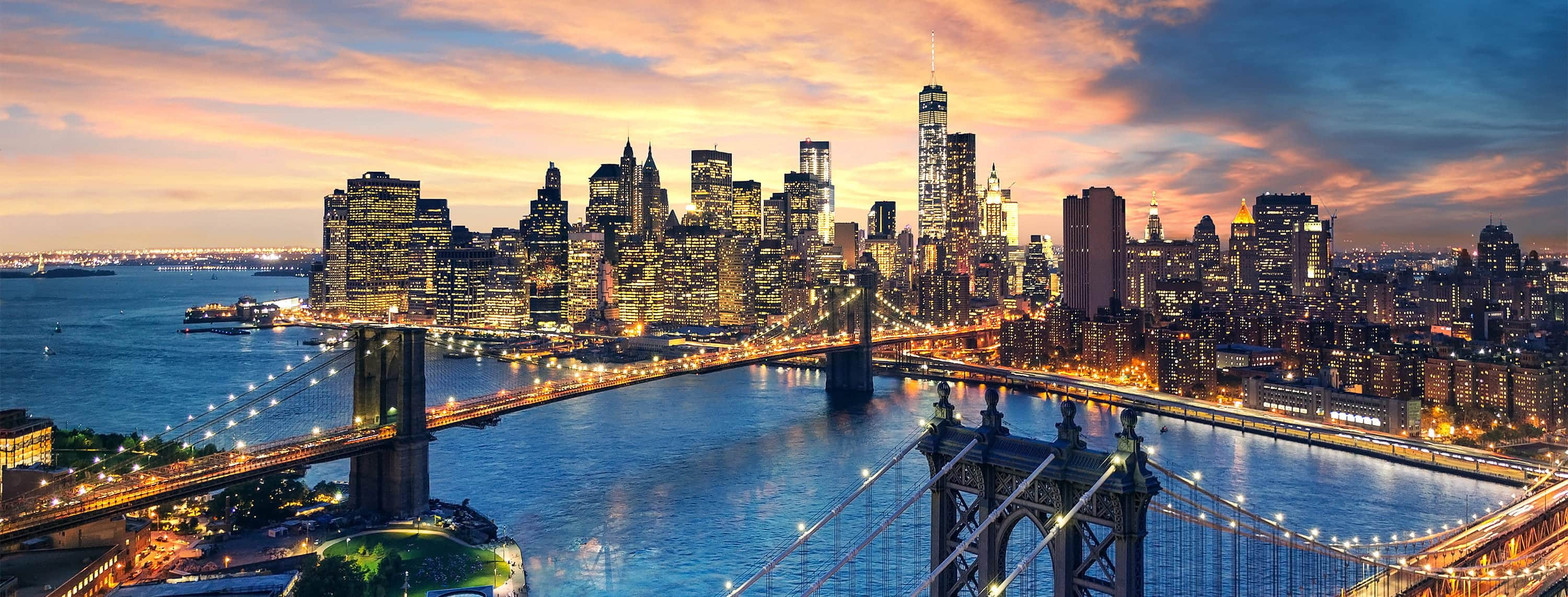 Manhattan and Brooklyn bridges at sunset