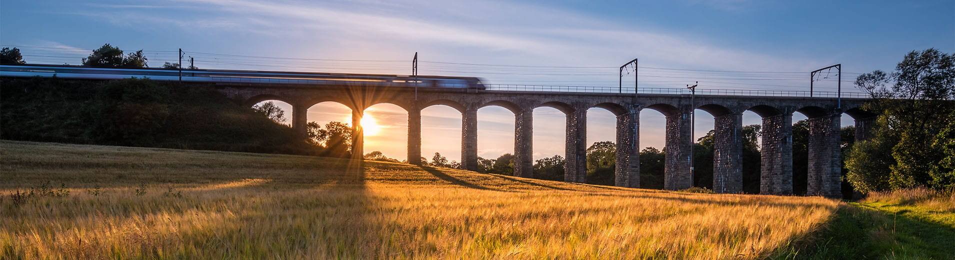 Train on River Aln Viaduct at Lesbury_S_2014