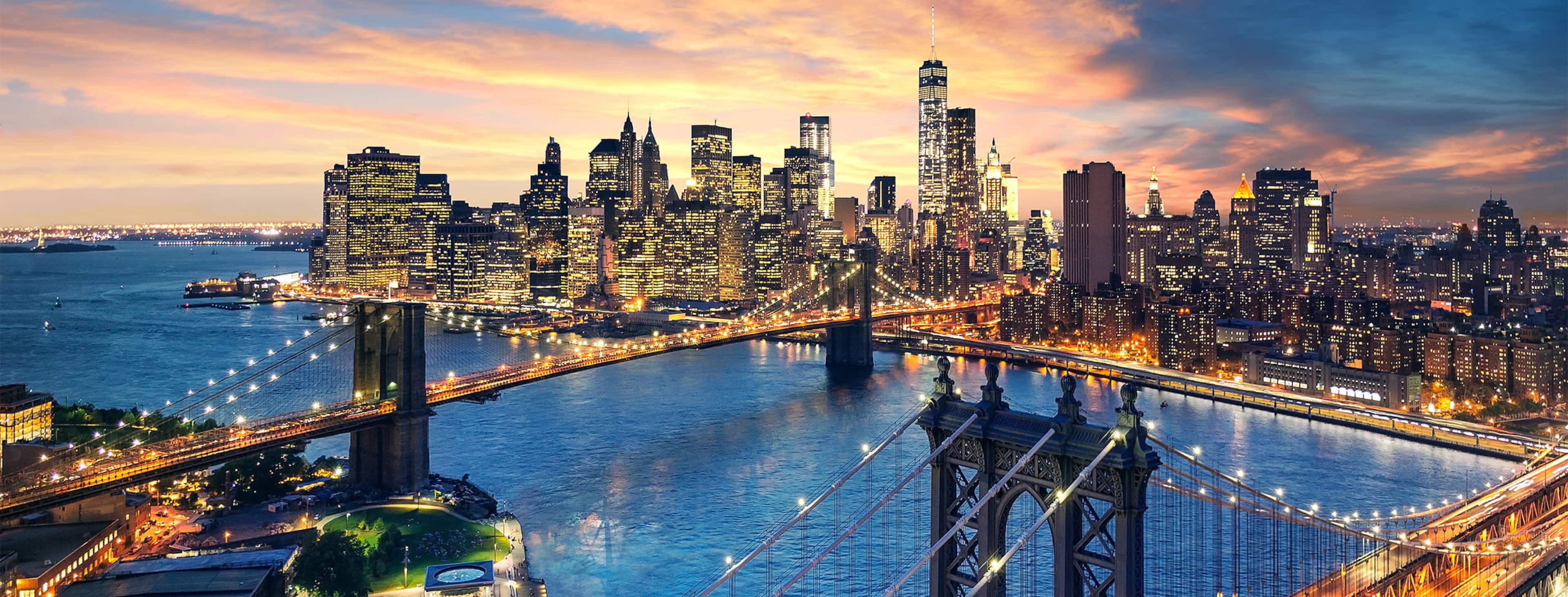 Manhattan and Brooklyn bridges at sunset